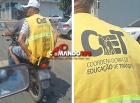 Homem usando colete da Coordenadoria de Educação de Trânsito é flagrado trafegando na garupa de moto sem capacete, em Ji-Paraná